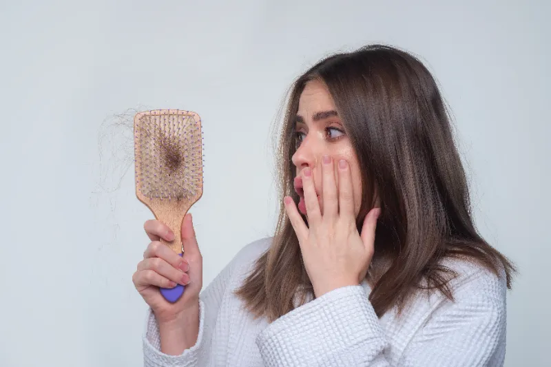 women holding comb in hand