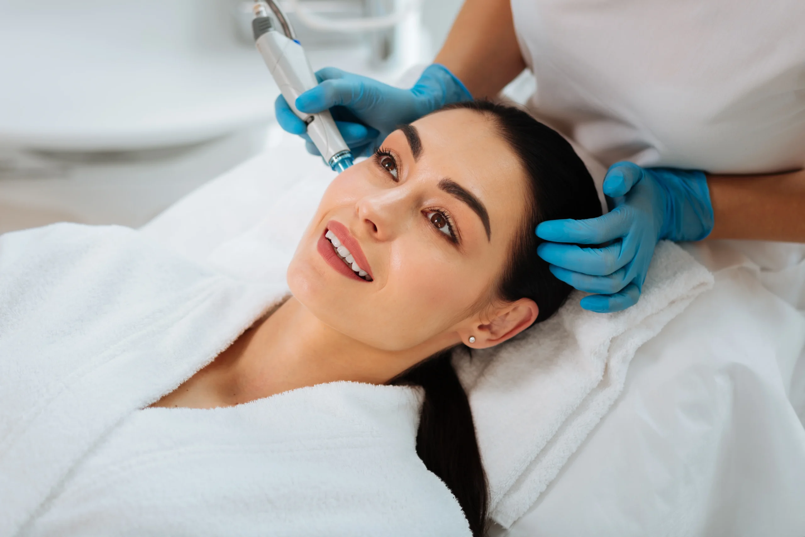 joyful-positive-woman-smiling-while-enjoying-beauty-procedure